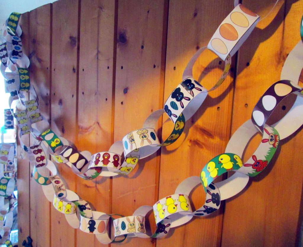 A line of our Easter paper chains linked together and hanging up.