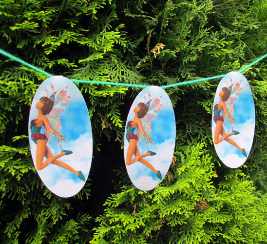 Pretty fairy bunting hanging in a garden